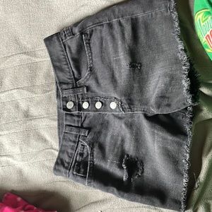 Black jeans with frase on the bottom